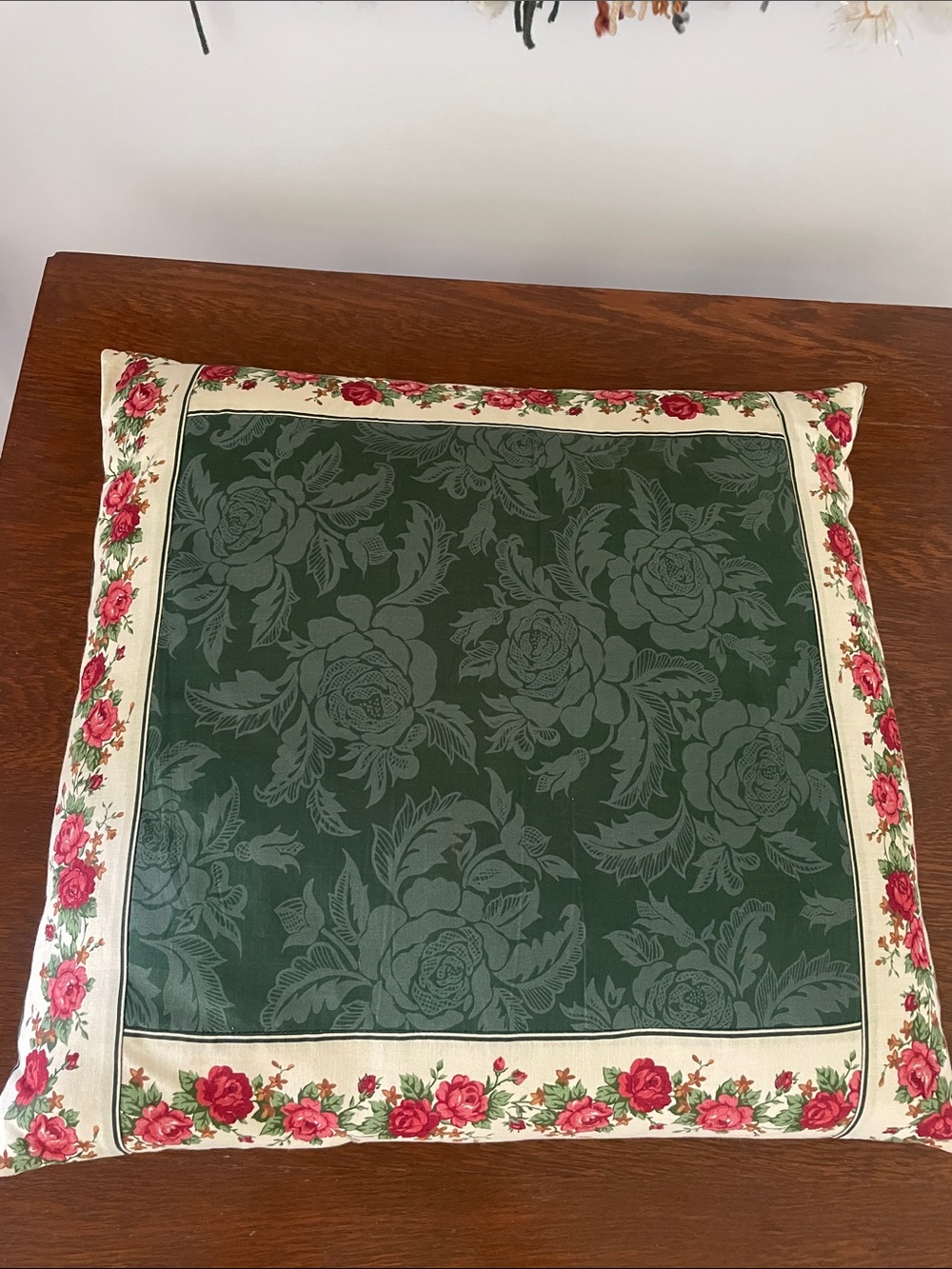 Vintage green floral pillow trimmed with flowers